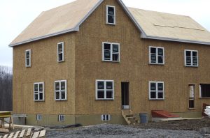 This photograph shows a new house under construction.